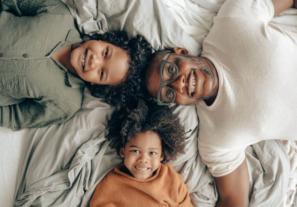 dad and kids smiling